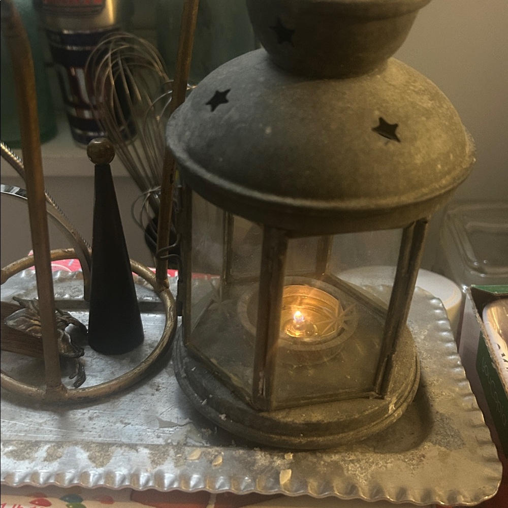 Lantern made of metal and glass that uses tea candle